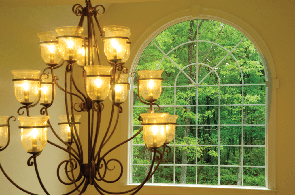 This arched window mimics the curves of the chandelier for a design that works throughout the entire home